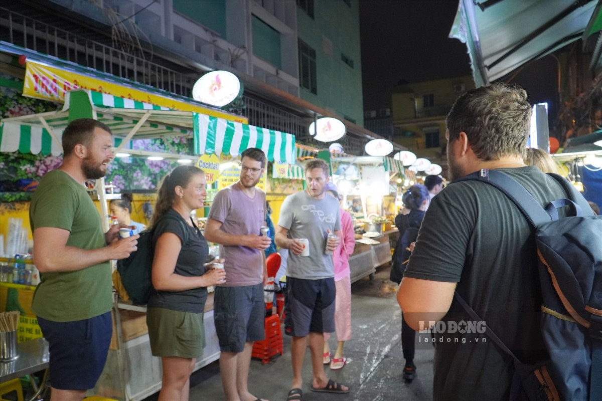bustling food street in ho chi minh city attracts tourists at night picture 8