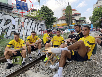 German players visit the banned Hanoi rail track area