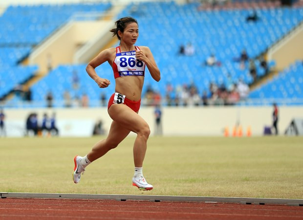 SEA Games 31: Vietnam win golds in running, rowing, wushu hinh anh 1