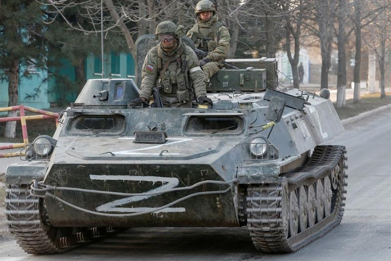 Ukraine bans Russian war symbols, Moscow says ready to resume talks