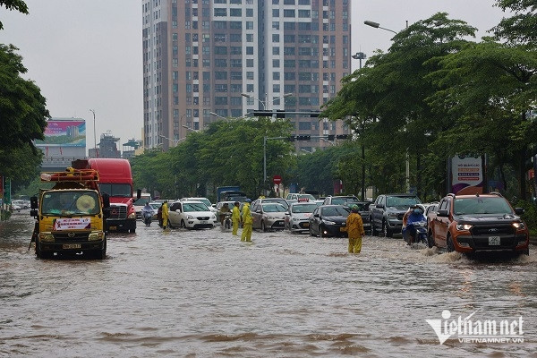 Immensely flooded from the alley to the street after heavy rain in Hanoi