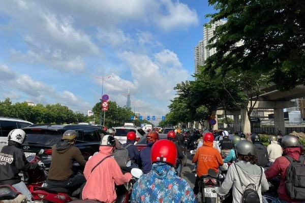 People are “crazy” plowing through traffic jams on the gateway road through the rich Thao Dien area