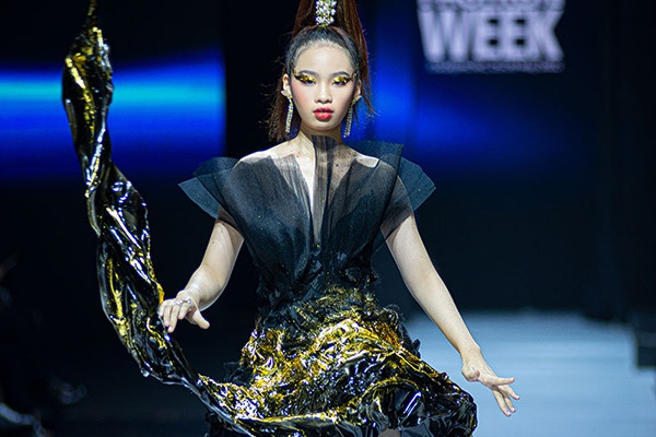 Baby model Bao Ha makes an impressive appearance on the catwalk