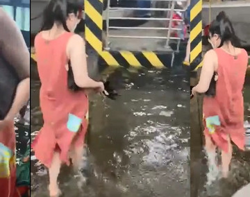 Xách vali, tháo giày lội nước vào ga ở sân bay Tân Sơn Nhất sau mưa lớn