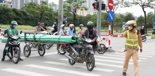Three-wheeled vehicles still running on Hanoi streets