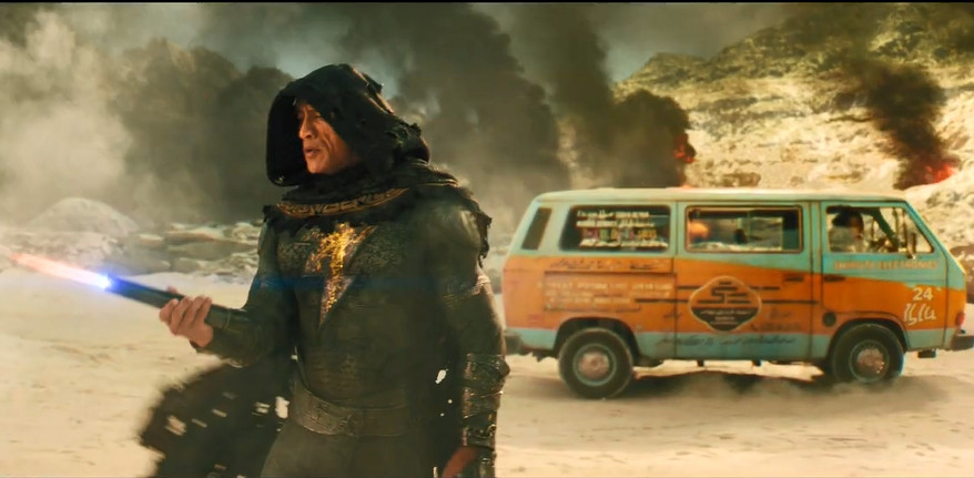 The Rock in bronze skin, using his hands to catch rockets in the ‘Black Adam’ trailer