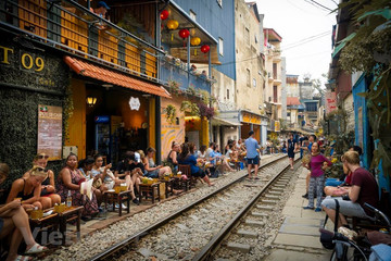 Cafes on Hanoi train street beg to stay open