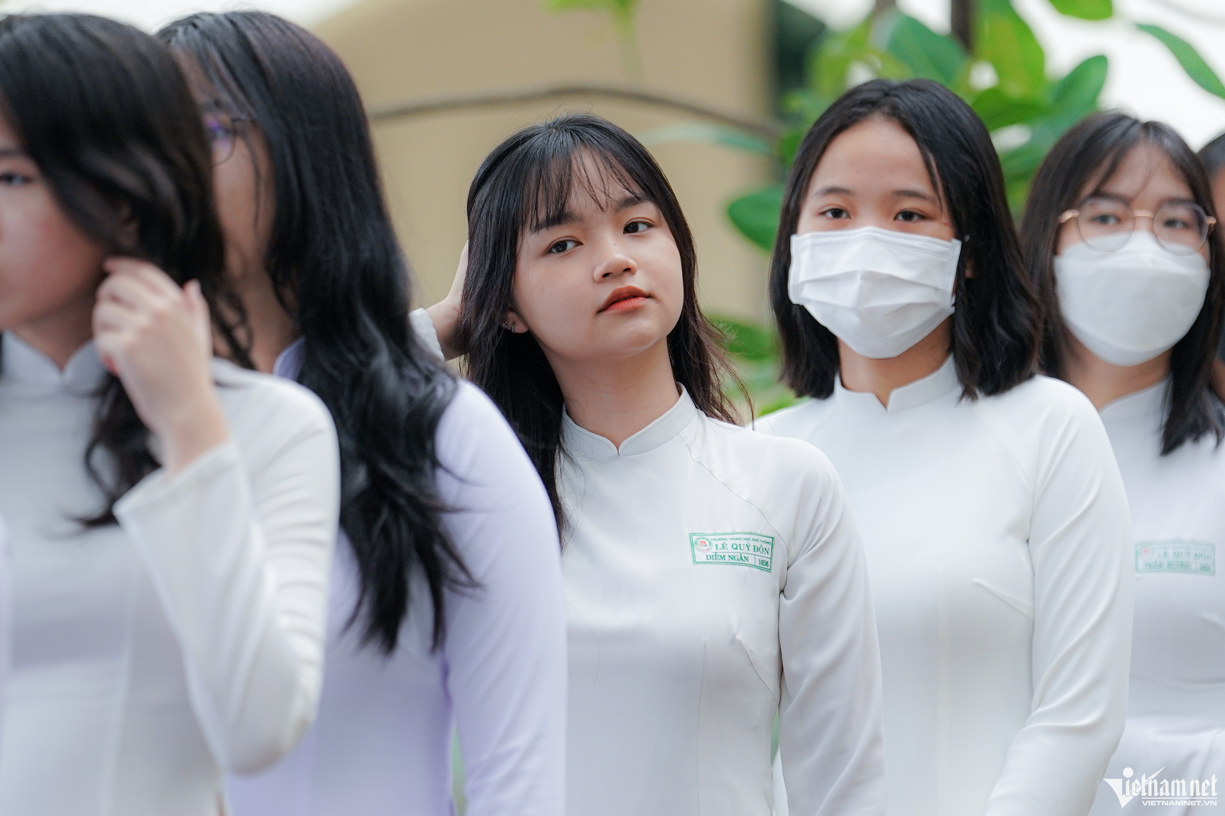 Female students in white ao dai on first school day