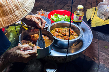 Cheapest pork-meatball bread in Vietnam sold by 87-year-old woman