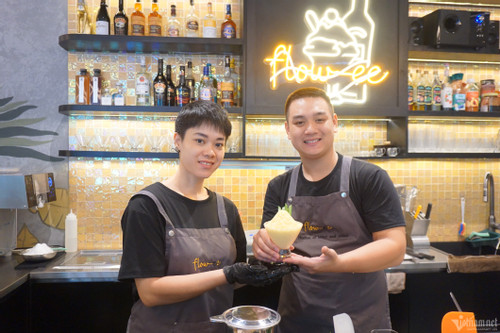 A silent cafe in Hanoi: customers gesture, waiters smile and nod