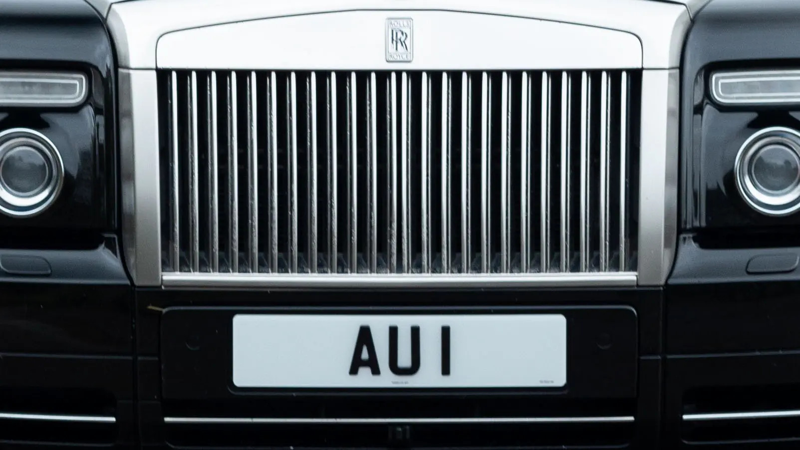 3 au 1 number plate for sale via primo registrations pictured on modern rolls royce portraitjpg.webp