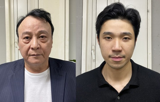 The defendants Do Anh Dung (L) and Do Hoang Viet ảnh 1