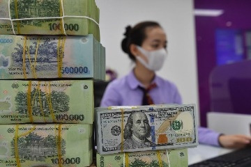 Giá USD ngân hàng giảm nhanh theo giá thế giới