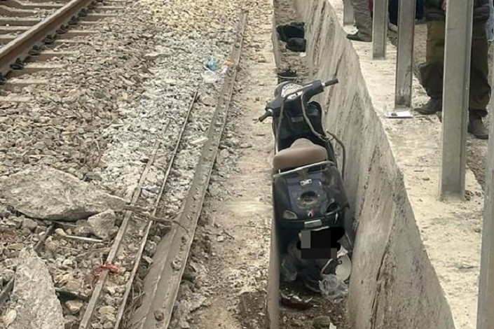 Two die crossing railway in Hanoi