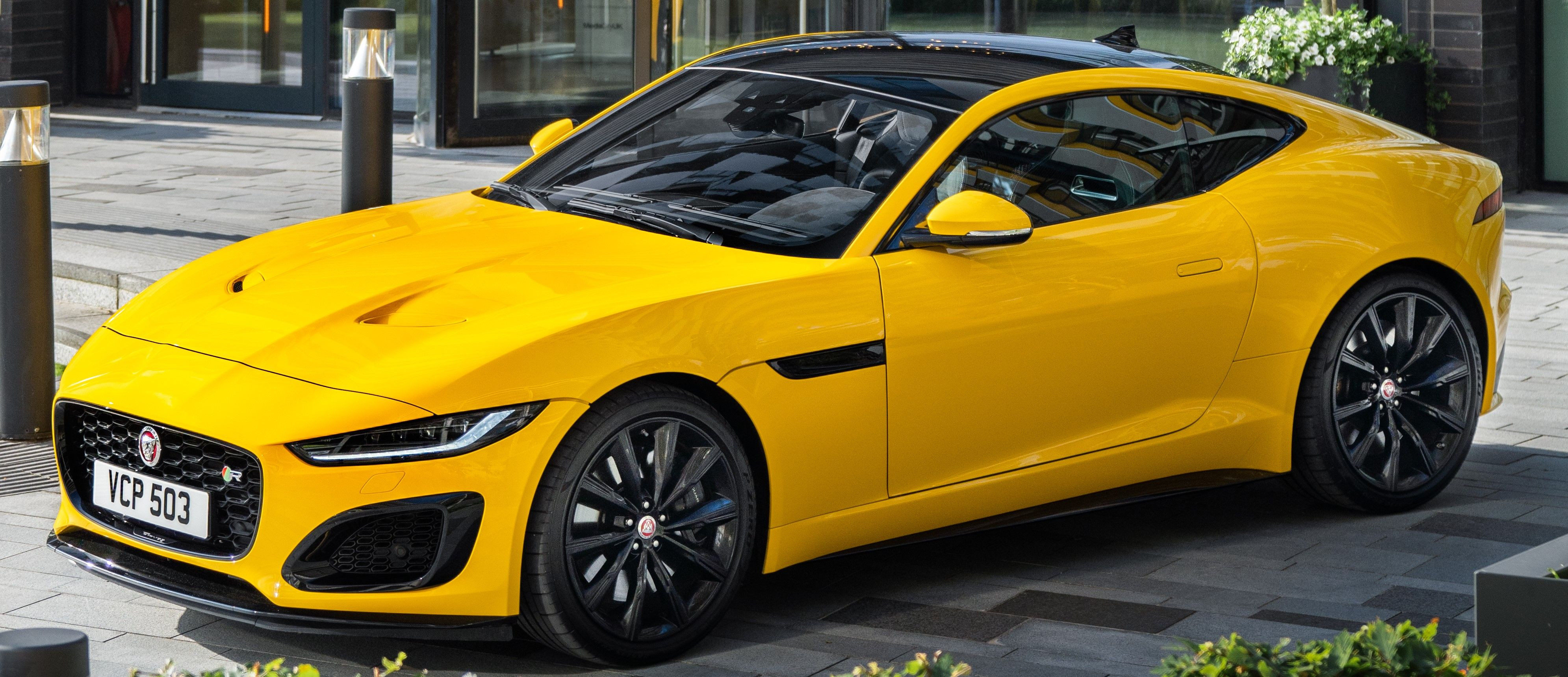 Yellow 2022 Jaguar F-Type Coupe parked outdoors
