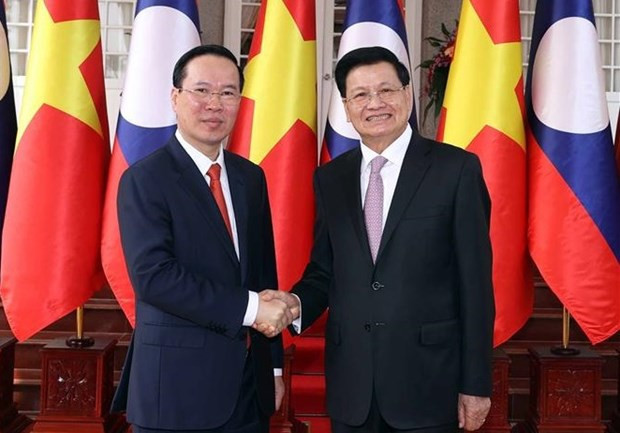 President holds talks with Party General Secretary, President of Laos hinh anh 1