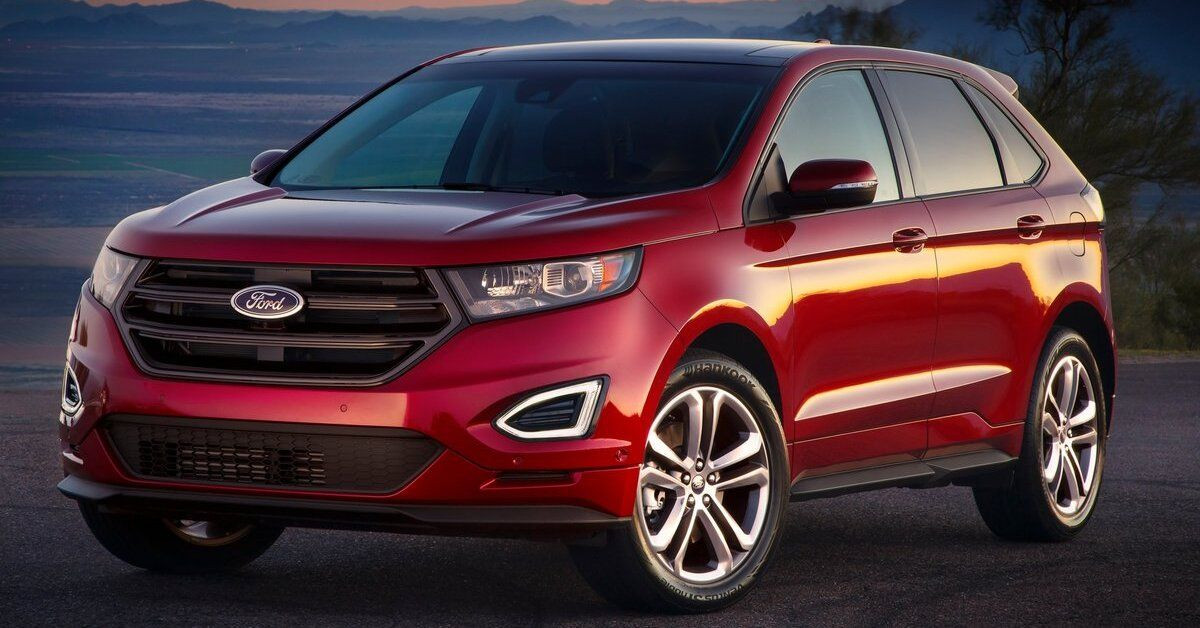 A red 2015 Ford Edge parked