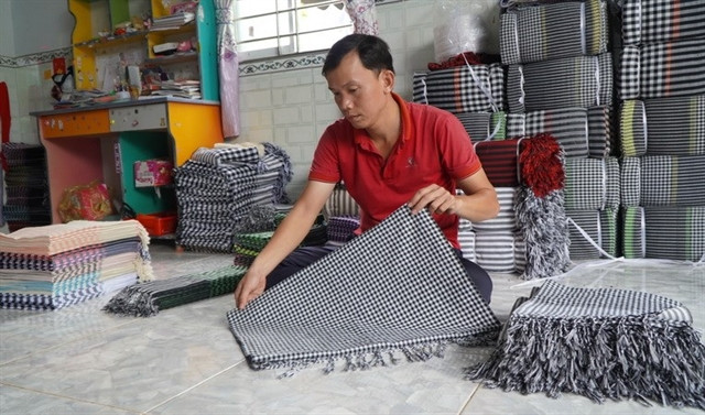 Checkered history: Vietnam's traditional scarf weaving