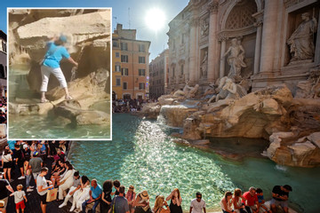 Nữ du khách trèo vào đài phun nước nổi tiếng nhất thế giới hứng nước uống