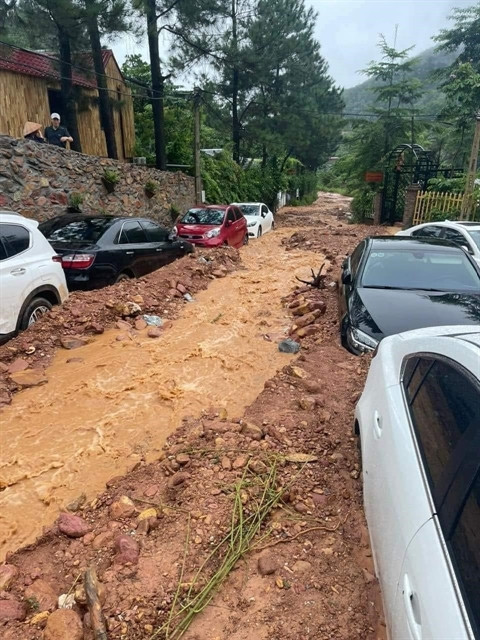 Landslides, flooding kill 7, destroy property, roads