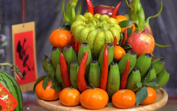 Arranging five-fruit tray during Tet celebration – a Vietnamese tradition