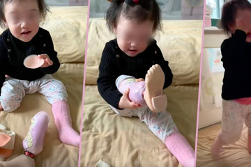 Bé gái 2 tuổi lần đầu tự đeo chân giả khiến hàng chục ngàn người xúc động