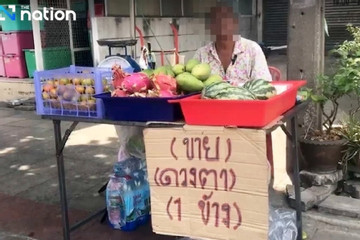 Nợ nần chồng chất, một người Thái Lan rao bán mắt bên lề đường