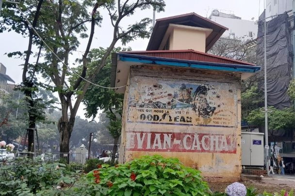 Colonial-era French ad posters preserved on Hanoi street