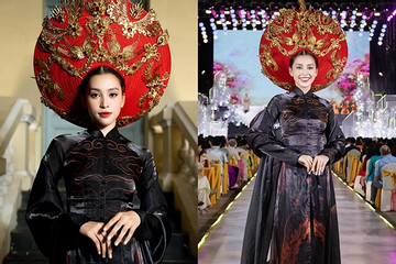 Hoa hậu Tiểu Vy diện áo dài 10m khoe dáng trên sàn catwalk