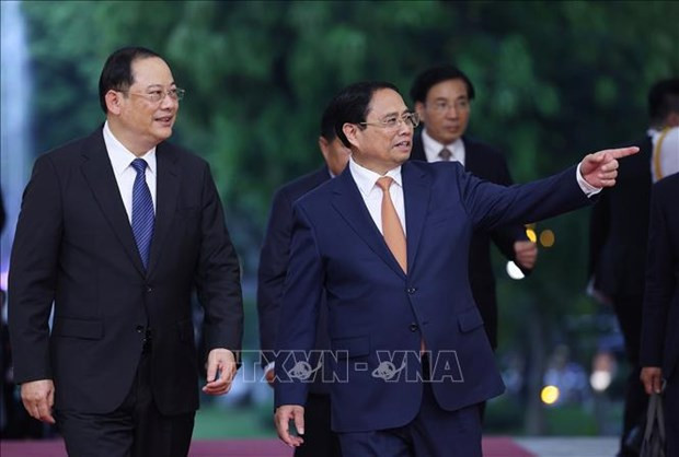 Vietnamese, Lao PMs join in working session in Hanoi hinh anh 1