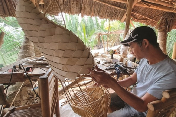 Bamboo craftsmen bend with market to survive