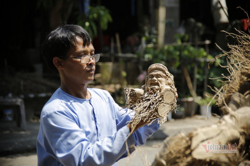 Craftsman from Hoi An turns rough base of bamboo into sculptures of faces