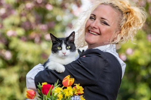 The woman married the cat because she was afraid that the owner would not allow her to have a pet