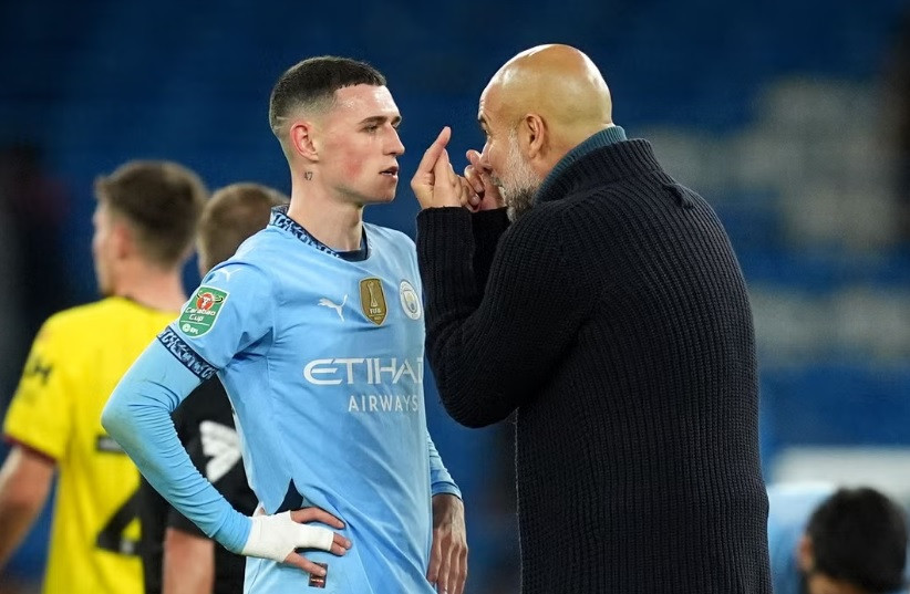 pep Guardiola Phil Foden Martin Rickett PA.jpg
