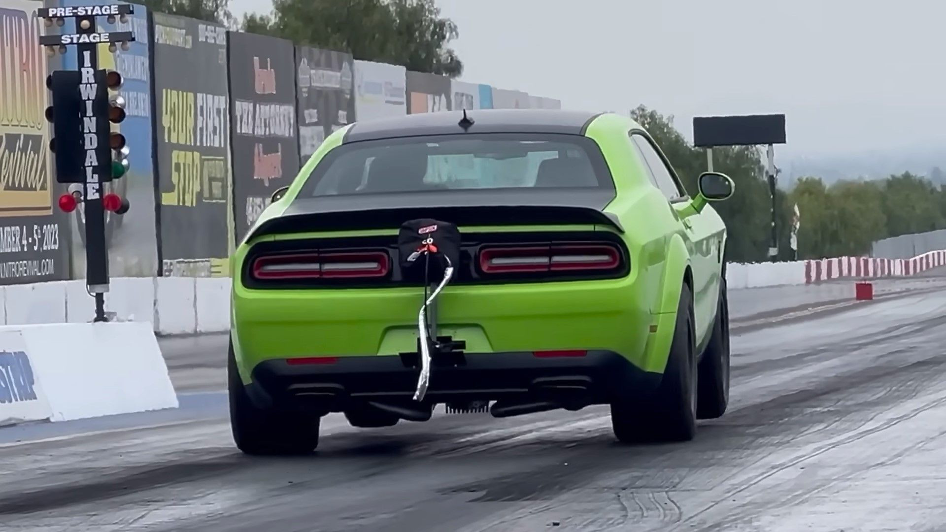 A sublime green 2023 Dodge Challenger SRT Demon 170 rear quarter shot