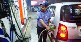 Filling petrol at petrol pump.jpg