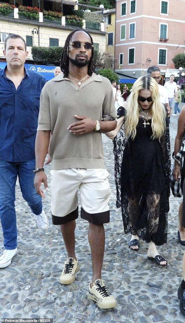 1723584643_383_Madonna 65 holds hands with new boyfriend Akeem Morris 28.jpg