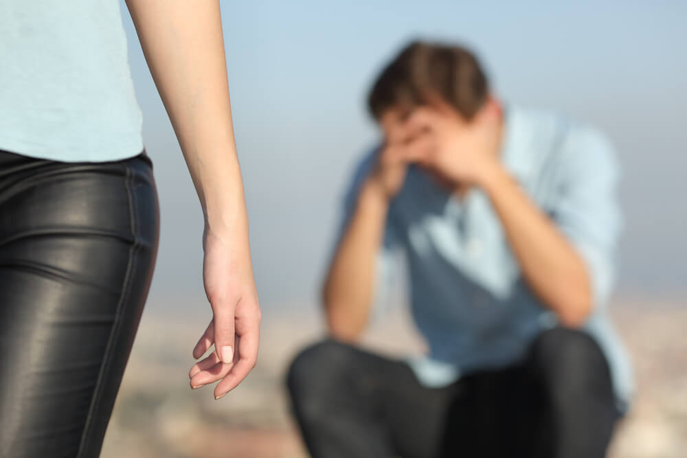 woman walking away from man.jpg