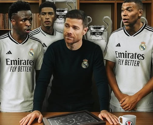 Xabi Alonso Enock Kobina Essel.jpg