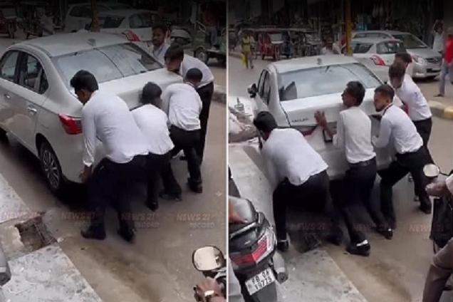 5 nam sinh viên cùng khiêng ô tô Honda đỗ chắn đường để giải tỏa ùn tắc