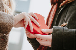 happy woman gifting heart shaped box man (1).jpg
