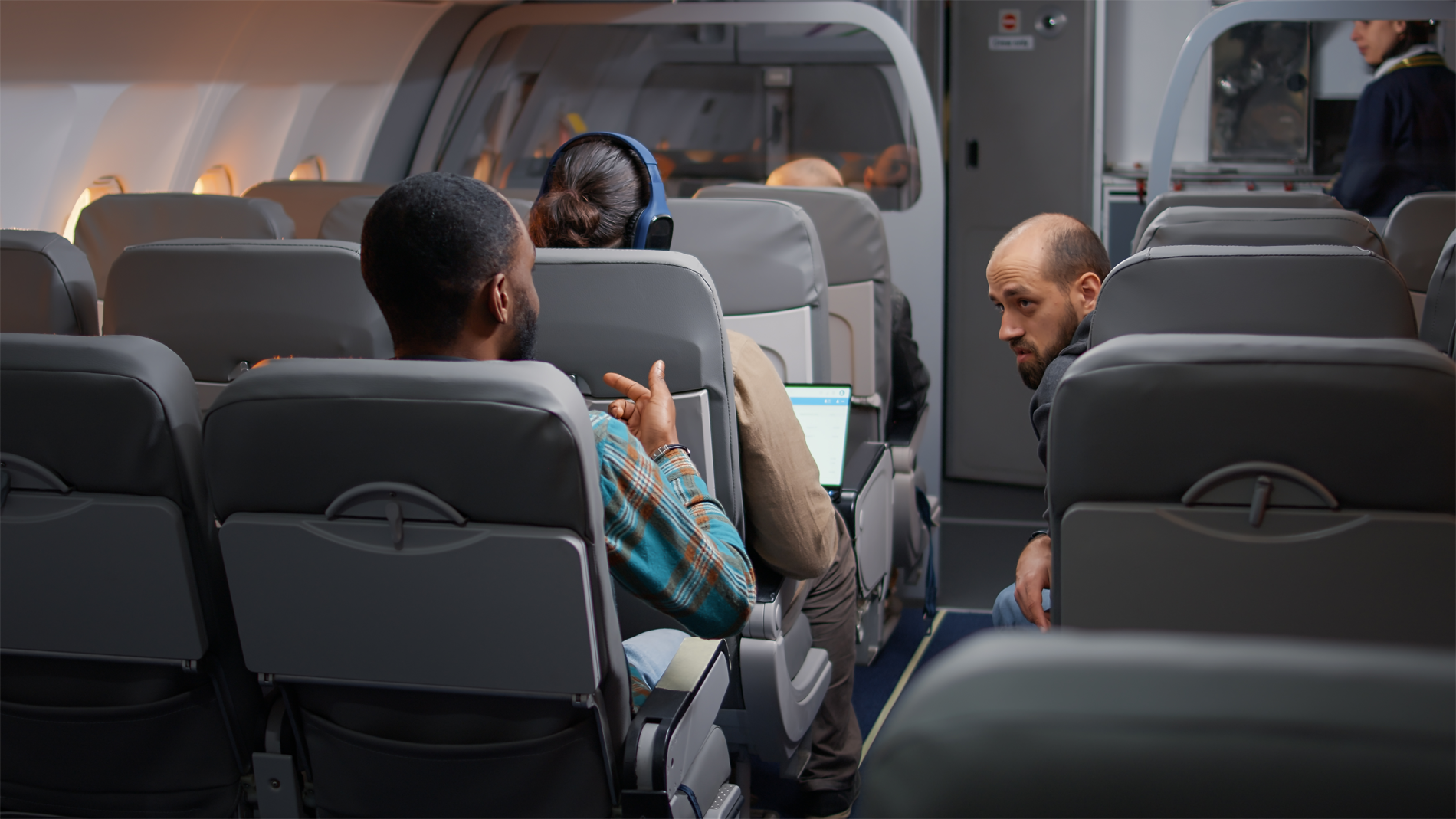 diverse travellers having conversation airplane before takeoff flying with international airline go holiday vacation travelling by plane with flight attendant commercial airways.png