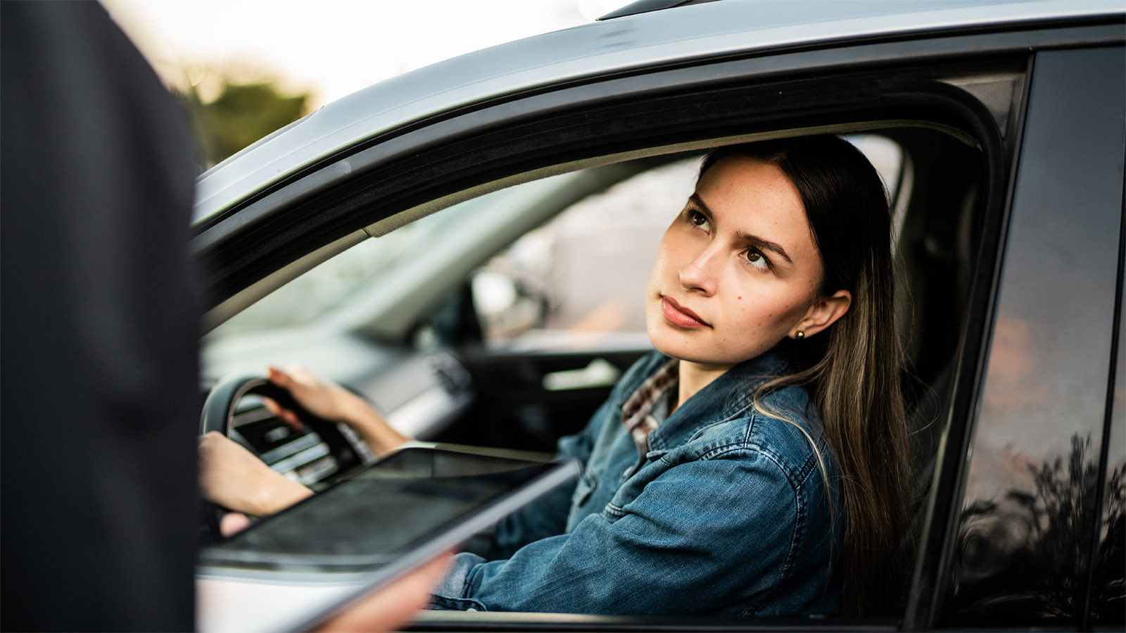 young woman talking to traffic police.jpg