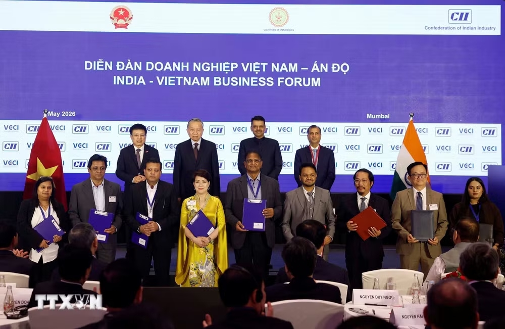 ttxvn-tong-bi-thu-chu-tich-nuoc-to-lam-phat-bieu-khai-mac-tai-dien-dan-hop-tac-thuong-mai-dau-tu-du-lich-viet-nam-an-do-0705-4.jpg