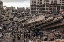 Rescuers, civilians and emergency medical workers looking for survivors in the rubble of several collapsed buildings, in La Guaira, Venezuela, on Saturday. NYT