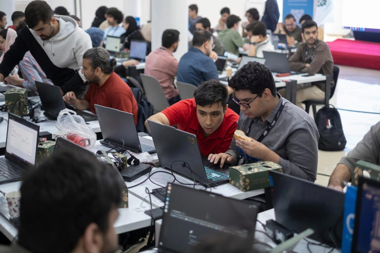 A programmer's viral post says AI coding is turning engineers into button-pushers. Morteza Nikoubazl/NurPhoto