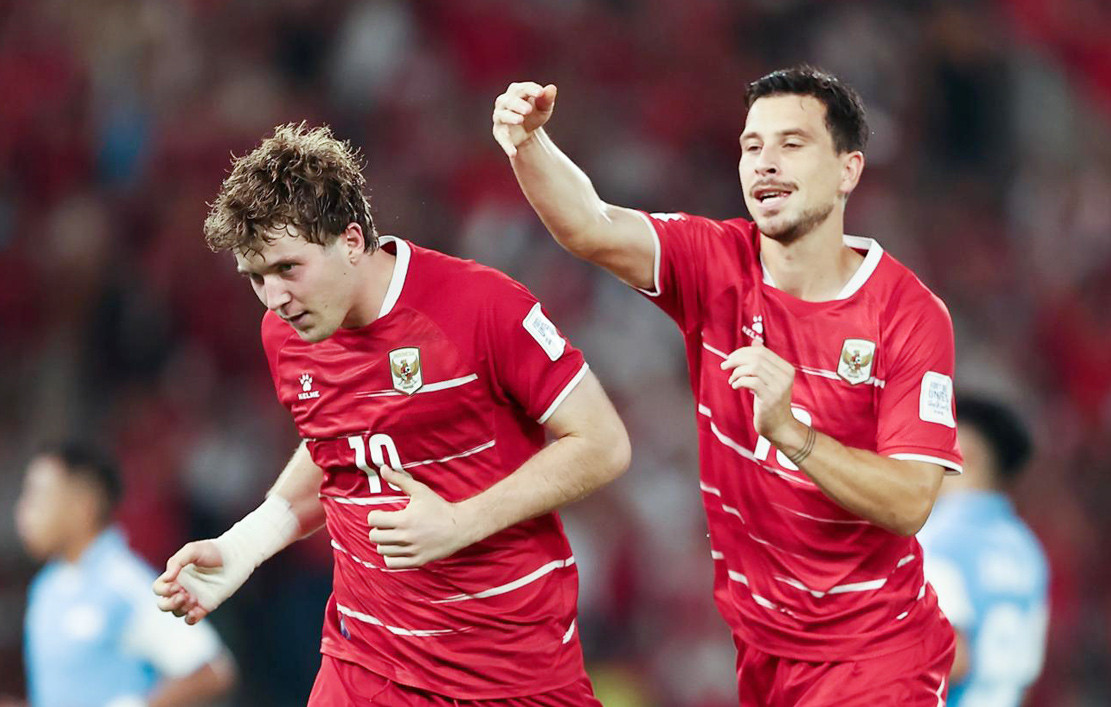 Ole Romeny 10 of Indonesia and Thom Haye 19 of Indonesia celebrate scoring their team s second goal during the during the FIFA ASEAN CUP Division 1 Group A match between Indonesia and Singapore at Gelora Bung Karn.jpg