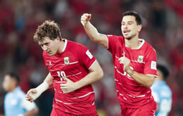 Ole Romeny 10 of Indonesia and Thom Haye 19 of Indonesia celebrate scoring their team s second goal during the during the FIFA ASEAN CUP Division 1 Group A match between Indonesia and Singapore at Gelora Bung Karn.jpg