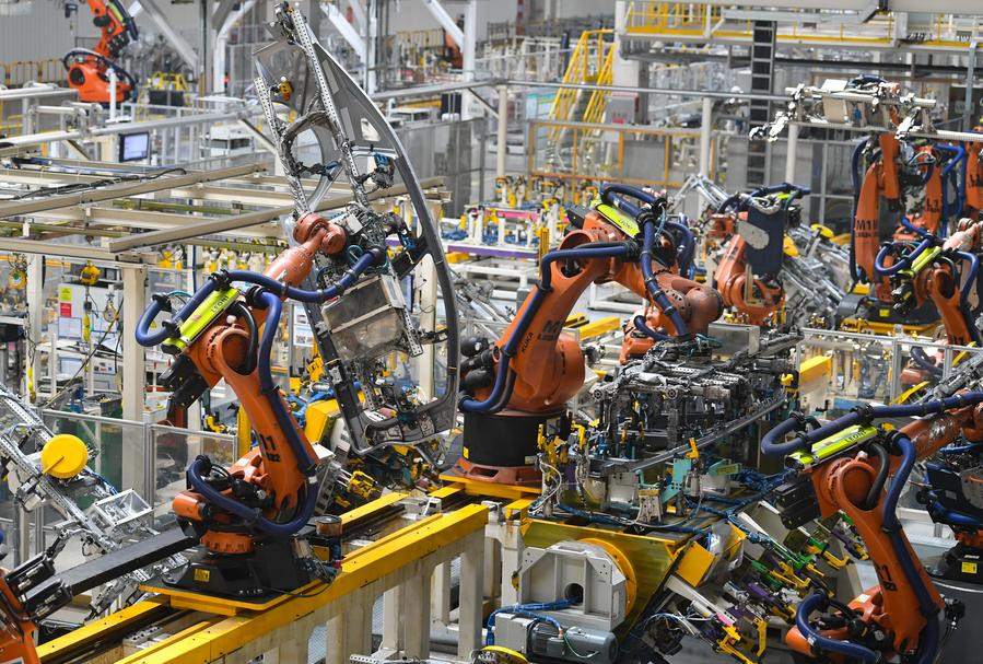 This photo taken on July 3, 2023 shows robotic arms working in the welding workshop of GAC Aion New Energy Automobile Co., Ltd. in Guangzhou, south China's Guangdong Province. (Xinhua/Deng Hua)