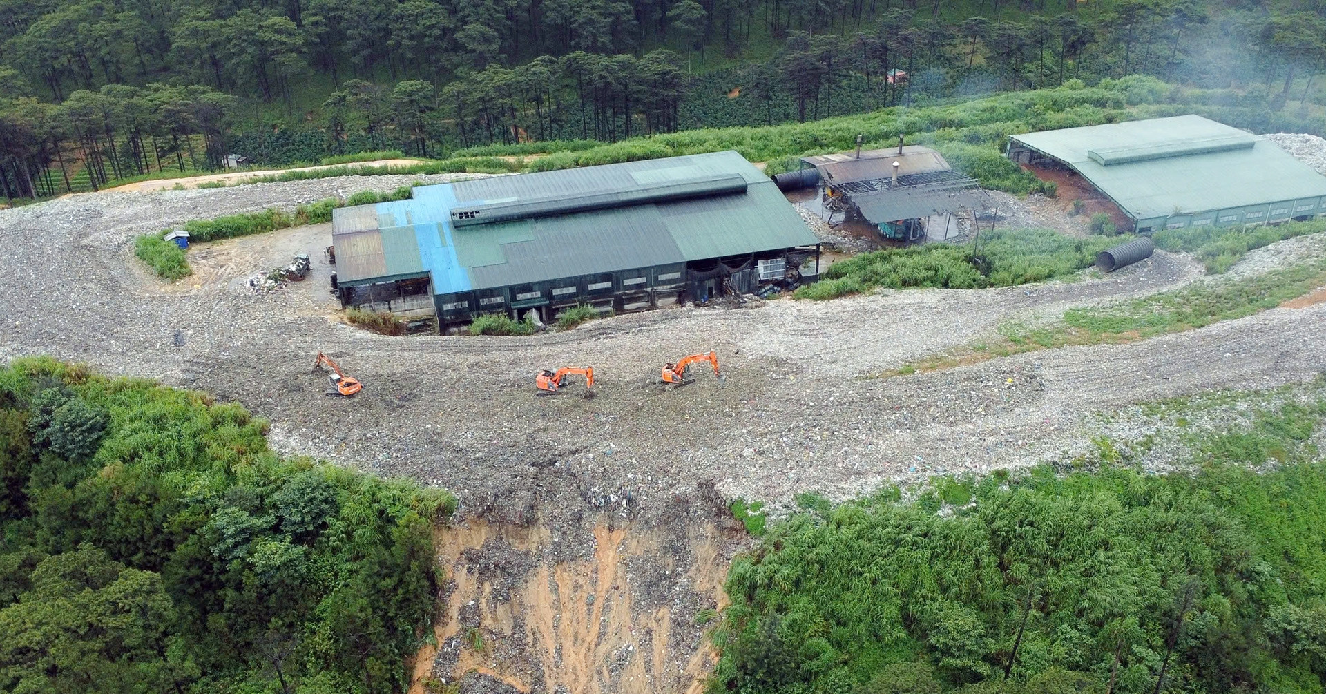 Tons of waste slide downhill, burying coffee farms in Da Lat